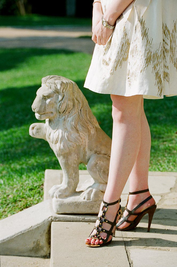 Outdoor lion decor and stylish shoe detail - wedding photo by top Austin based wedding photographers Q Weddings